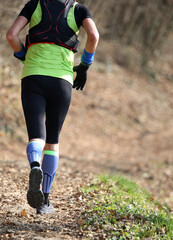 Wall Mural - runner during marathon in the middle of the woods in autumn