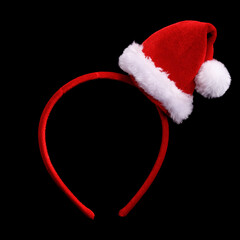 Poster - red head hoop with santa claus hat isolated on black background