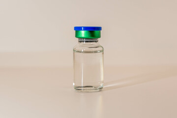 Wall Mural - bottle or vial of vaccine, white background with copyspace
