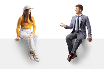 Sticker - Man in suit and tie talking to a female teenager seated on a blank panel