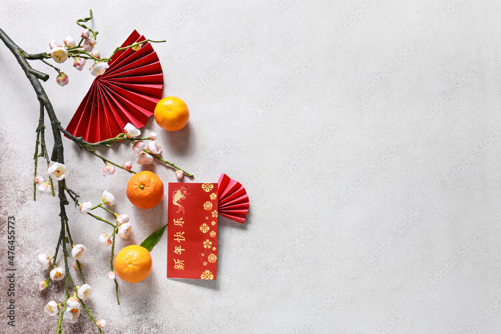 Red envelope with Chinese symbols on light background. New Year celebration