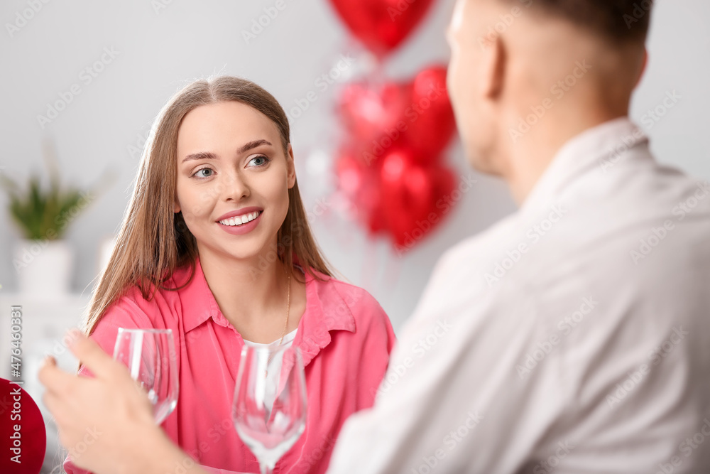 Happy couple celebrating Valentine's Day at home