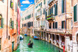 Venice canal and famous gondola, romantic view of Italy