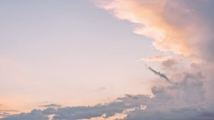 Wall Mural - dramatic cloudy pastel colored sunset sky