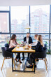 © DSMT - Successful meeting of business people, discussing new business ideas, using diagrams, sitting together. Modern office background. Meeting of business partners at the conference on business development