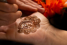 Woman Applying Henna On Hands 