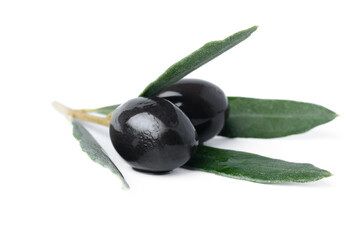 Wall Mural - Black olives with leaves isolated on white background