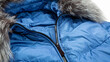 women winter fashion concept. blue jacket. down jacket with a hood. Winter outerwear for women on white background.