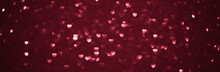 Background Bokeh In The Form Of Hearts Of Red And Pink Color. Copy Space For Text. The Concept Of Romance And Love. Valentine's Day. Shiny Texture Background. Festive Background.