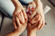 © Владислав Легір - Children's feet in hands of mother and father. Small newborn baby legs in mothers and fathers lovely hand with soft focus. Family love. Happiness concept. Family care