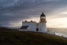 Stoer Lighthouse In Northern Scotland, On A Beautiful Sunset.