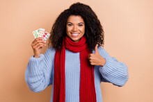 Photo Of Young Lady Show Thumb-up Perfect Suggest Feedback Meds Painkillers Isolated Over Beige Color Background