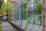 Fototapeta Na drzwi - An unusual fence is made of metal rods on the streets of Yerevan. Armenia 