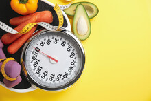 Flat Lay Composition With Scales And Vegetables On Yellow Background, Space For Text