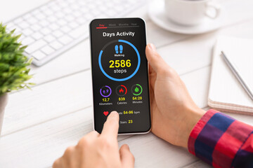 Poster - Unrecognizable man checking his heart rate while working