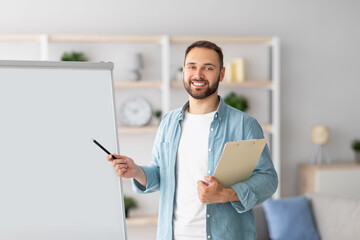 Poster - Professional male tutor pointing at blank blackboard, giving remote lesson, conducting web conference with students