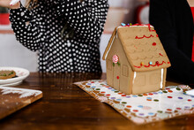 Decorating A Ginger Bread House With Candy 