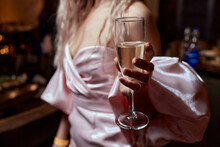 Close-up Of Gorgeous Woman With A Glass Of Champagne. Party And Holiday Celebration.
