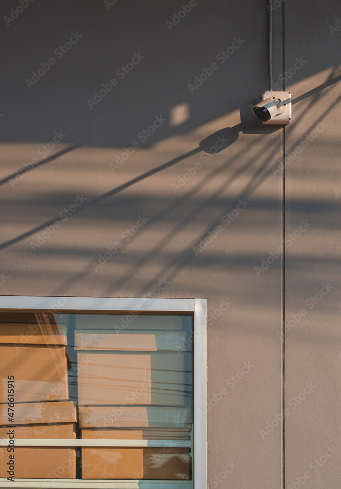 Secure Wall Box Cardboard boxes on shelf inside of glass wall frame with security ...