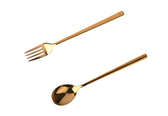 Top view of golden spoon and fork white background