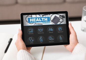 Aufkleber - Female hands holding digital pad with online health app