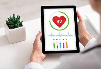 Poster - Woman using healthcare application on digital tablet