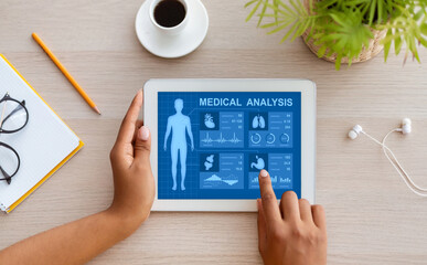 Aufkleber - Above view woman using health app on tablet at home