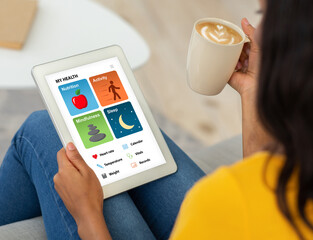 Aufkleber - Young black woman with coffee using tablet, checking health