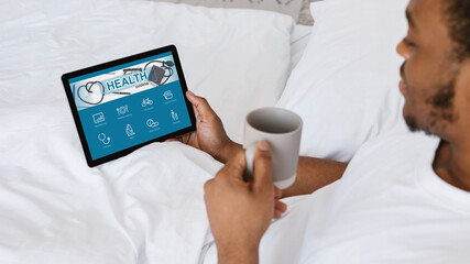 Aufkleber - African american guy using health application on brand new pad