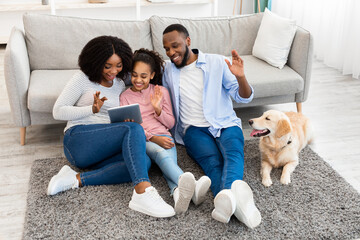 Poster - Black family having videocall using laptop waving hands