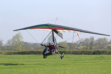 Poster - Ultralight airplane taxiing on a farm strip	