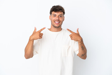 Wall Mural - Young caucasian handsome man isolated on white background giving a thumbs up gesture