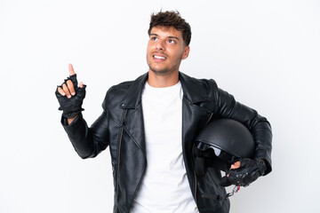 Wall Mural - Young caucasian man with a motorcycle helmet isolated on white background pointing up a great idea