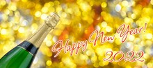 Bottle Of Champagne, Inscription Happy New Year 2022 On A Background Of Bright Festive Golden Bokeh Lights. Space For Text. The Concept Of A Holiday, Celebration, Party. Greeting Card