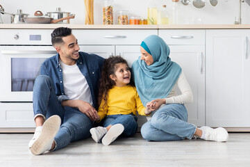 Wall Mural - Happy Arabic Family Of three Bonding Together At Home