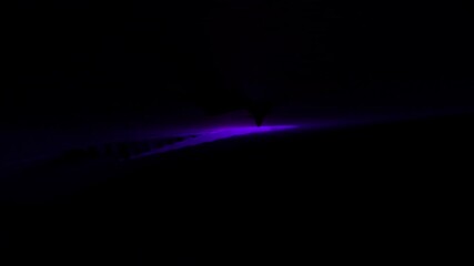 Poster - Background.Design. A black background and a comet in purple that falls on the background.