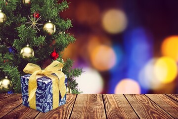 Wall Mural - Christmas Tree with Decorations And gift on bokeh background