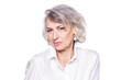 © satyrenko - Displeased retired old woman with wrinkled well cared face looks disappointed looking suspiciously at the camera isolated over white background