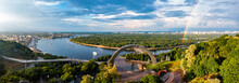 Panoramic View Of Kyiv City With A Beautiful Rainbow Over The City. Aerial View Of The Arch Of Friendship Of Peoples.
