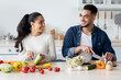 © Prostock-studio - Young Arab Spouses Cooking Healthy Lunch Together In Kitchen At Home
