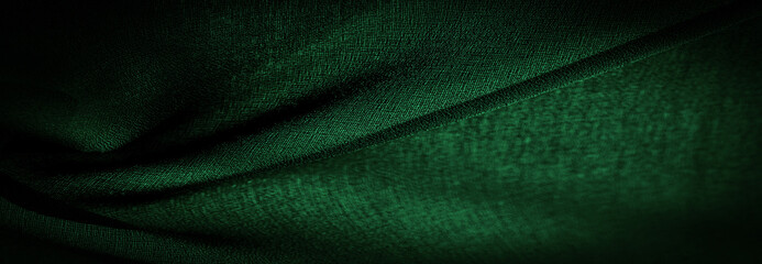 Background texture Dark green chiffon silk is a soft transparent fabric with a slight roughness (matte, creped) due to the use of twisted yarn.