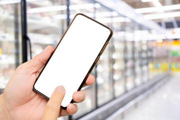 Man using smartphone in supermarket white screen.
