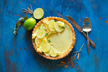 Appetizing beautiful lemon muffin in a light key, beautiful still life with a delicious cake on the table. Sweet delicacy in the pastry shop. lime dessert bakery products