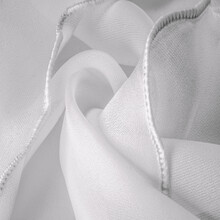 White Silk Organza With Wavy Piping. Border Around The Edge Of The Fabric. Abstract Background. Texture Pattern. Silk Organza Has A Delicate Open Weave. Wave Background. Copy Space