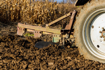 Wall Mural - Tractor machine of cultivating ground of soil preparation for planting crop, spring