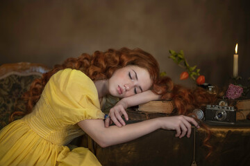 Wall Mural - Portrait of a red-haired girl lying on the table