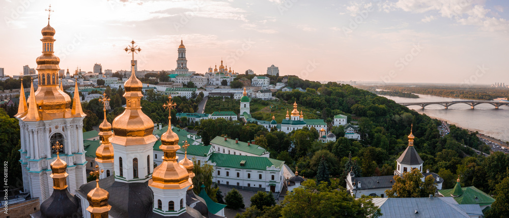 Magical aerial view of the Kiev Pechersk Lavra near the Motherland Monument. UNESCO world heritage in Kyiv, Ukraine. Kiev Monastery of the Caves at sunset.
