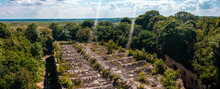 Aerial View Over Historical Ruined Castle And War Fort. Deep Forest Ruins Near Baden-Wurttemberg, Germany. Flying Through Ruins Of The Old Warehouse And War Buildings.