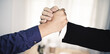 © 22January - two businessman shake hand after complete success project with teamwork. close up of business man in suit handshake after finishing up a business meeting in the city, congratulation, success, meeting