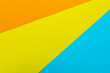 © Kritsada - Orange yellow and blue paper texure top view for background